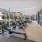 The fitness center at The District apartments for rent in Pittsburgh, PA, featuring treadmills and exercise machines.