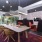 Resident lounge at The District apartments for rent in Pittsburgh, PA, featuring a long table with chairs.